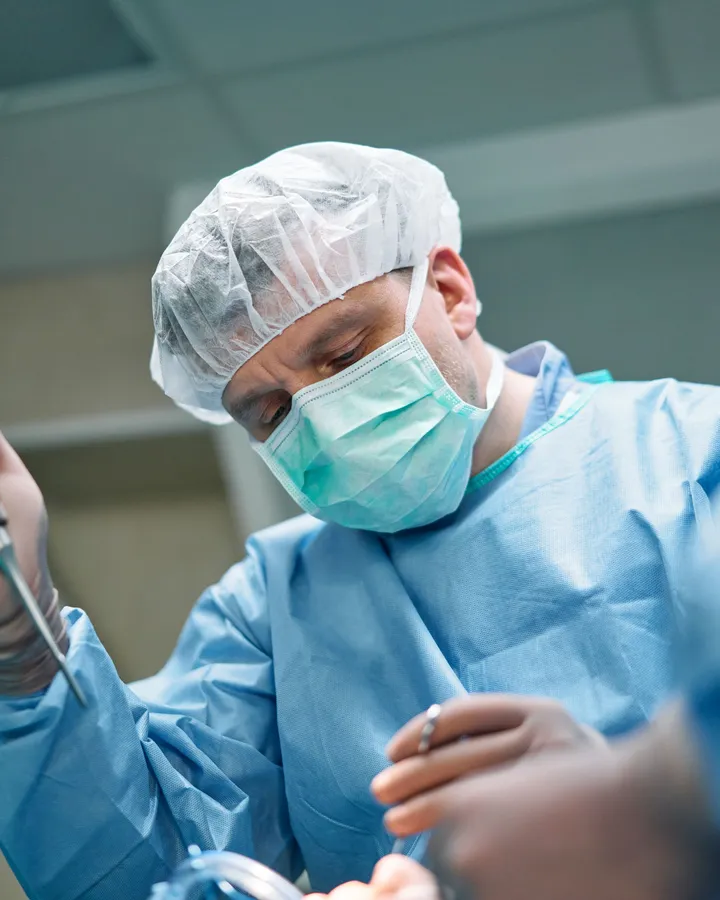 Focused surgeon during a procedure in the operating room